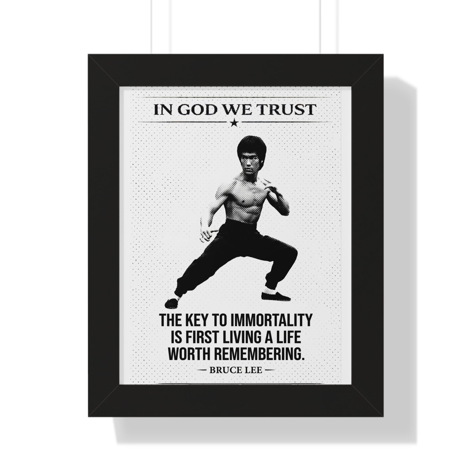 Framed poster with Bruce Lee quote 'In God We Trust' and 'The key to immortality is first living a life worth remembering.'