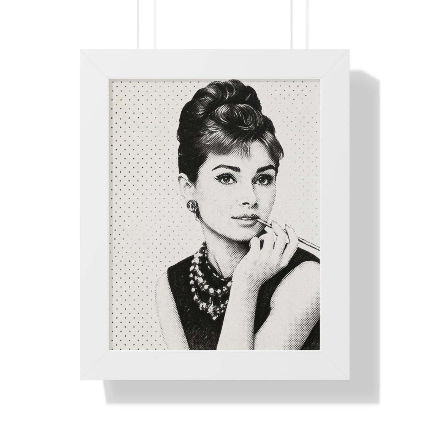 Framed black and white portrait of a woman with a polka dot background