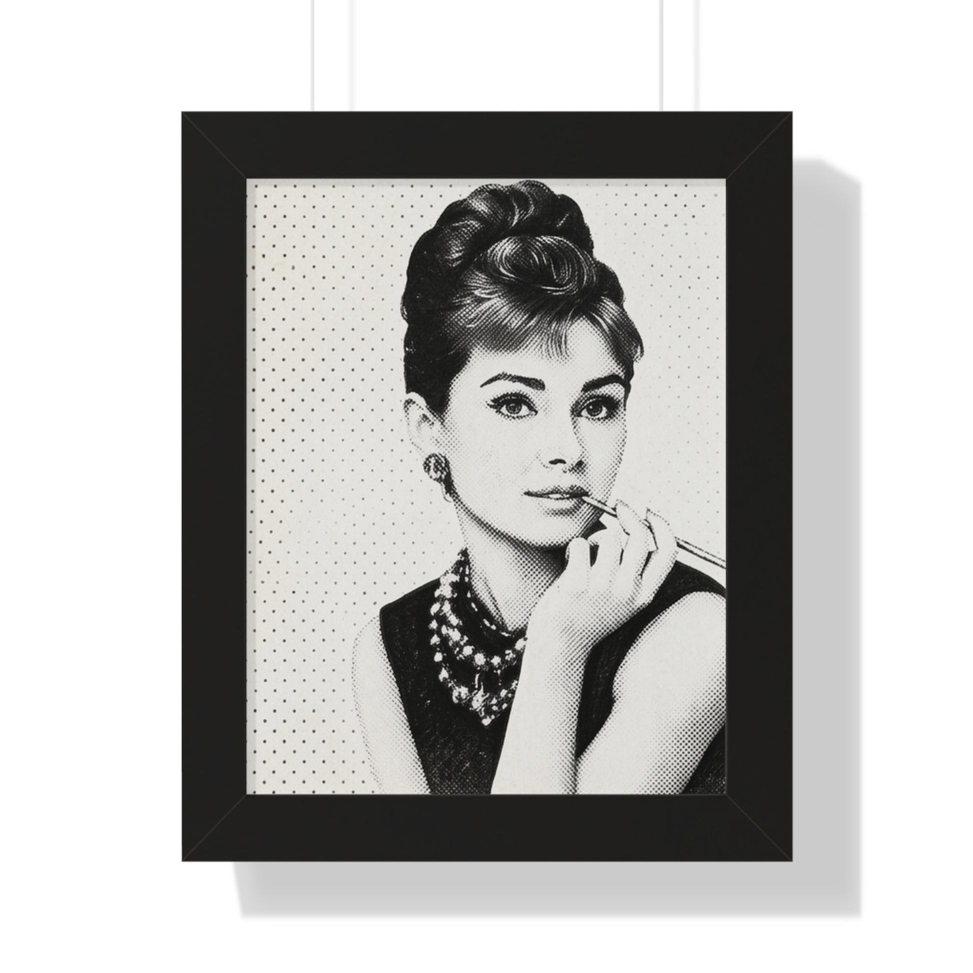 Framed black and white portrait of a woman with a polka dot background