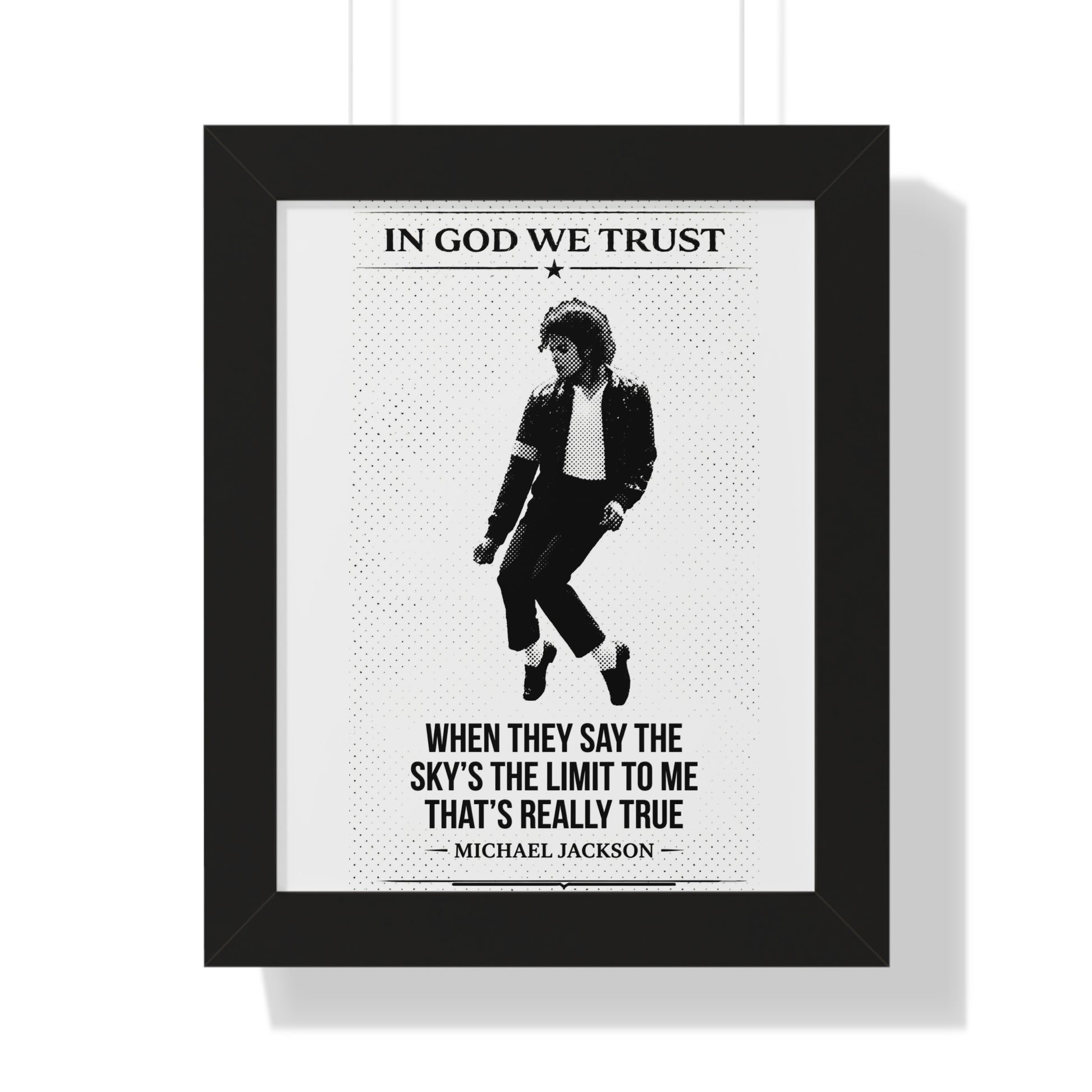 Framed poster with a black and white image of a person and text, featuring the quote 'In God We Trust'.