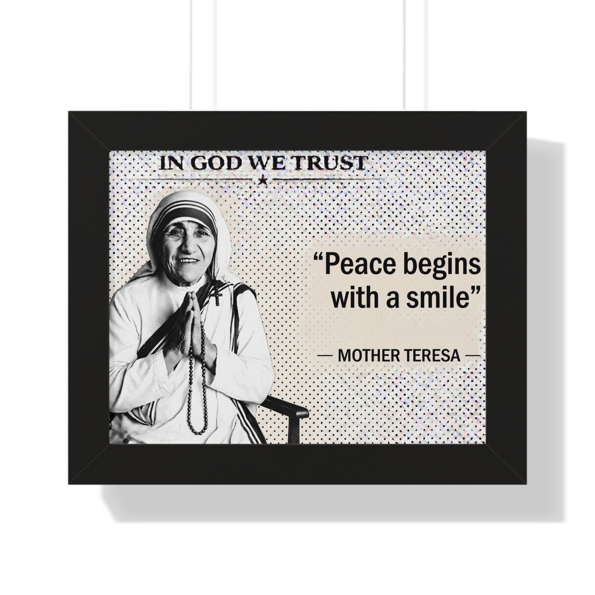 Framed poster with Mother Teresa quote 'Peace begins with a smile' and 'In God We Trust' above.
