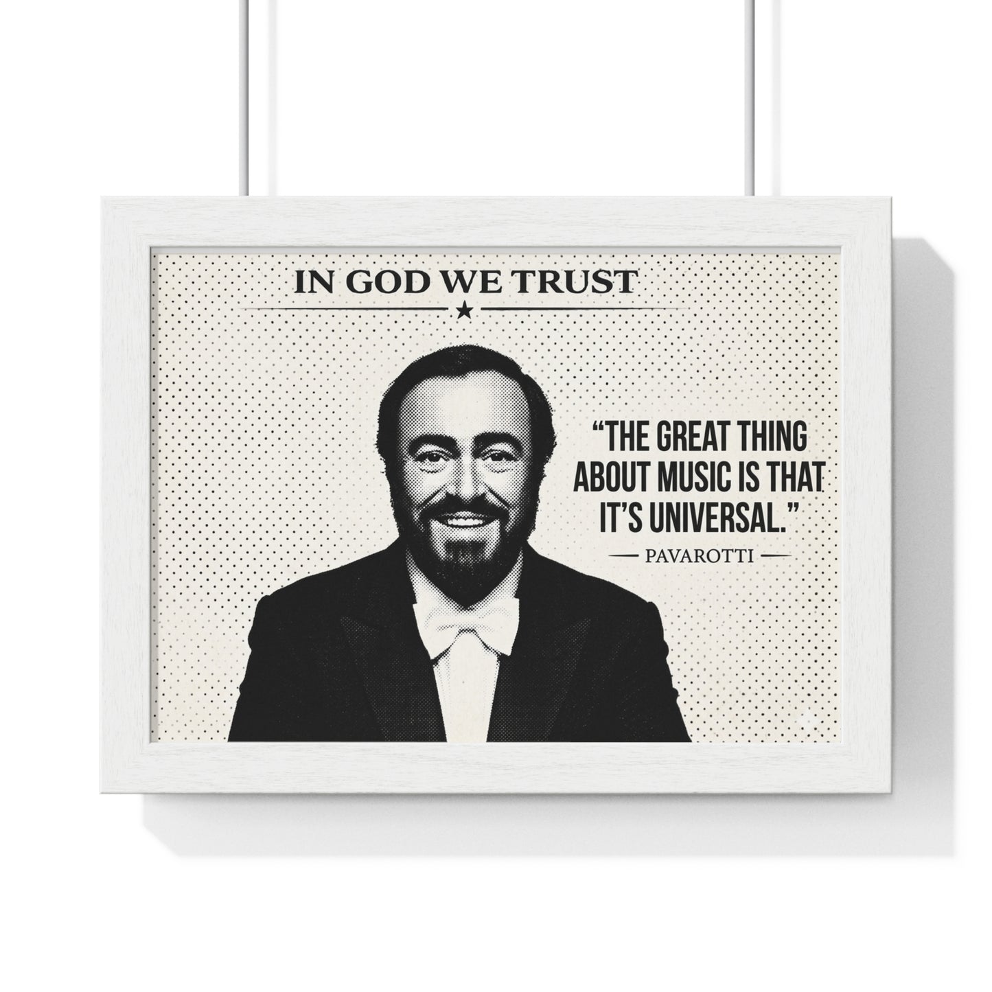 Framed poster with a portrait of a man and a quote, featuring the text 'In God We Trust' and 'The great thing about music is that it's universal. Pavarotti'.