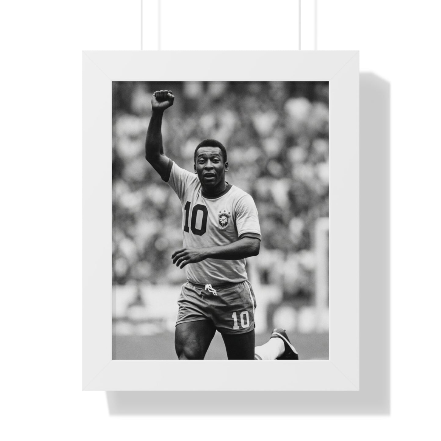 Black and white photo of a soccer player in a stadium