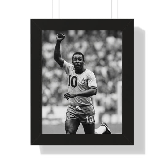 Framed black and white photo of a soccer player celebrating with a raised fist.