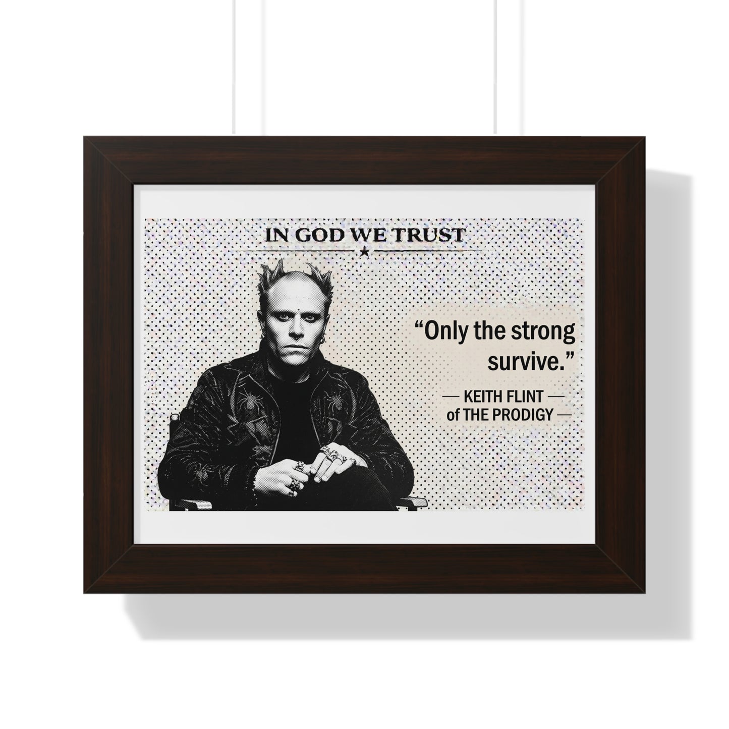 Framed poster with a black and white portrait of Keith Flint from The Prodigy, text 'In God We Trust' and 'Only the strong survive.'.