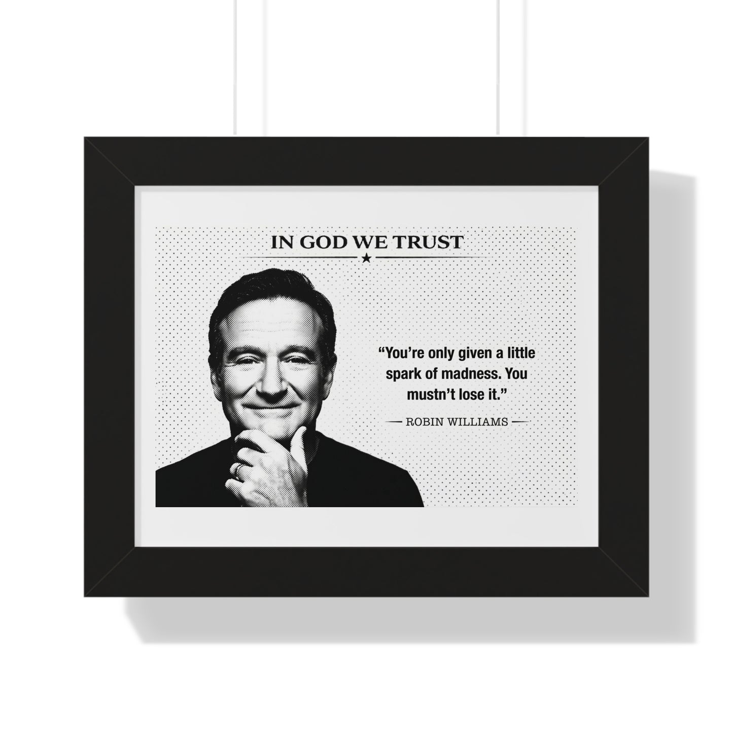Framed print with a portrait of a person and a quote by Robin Williams, featuring the text 'In God We Trust'.