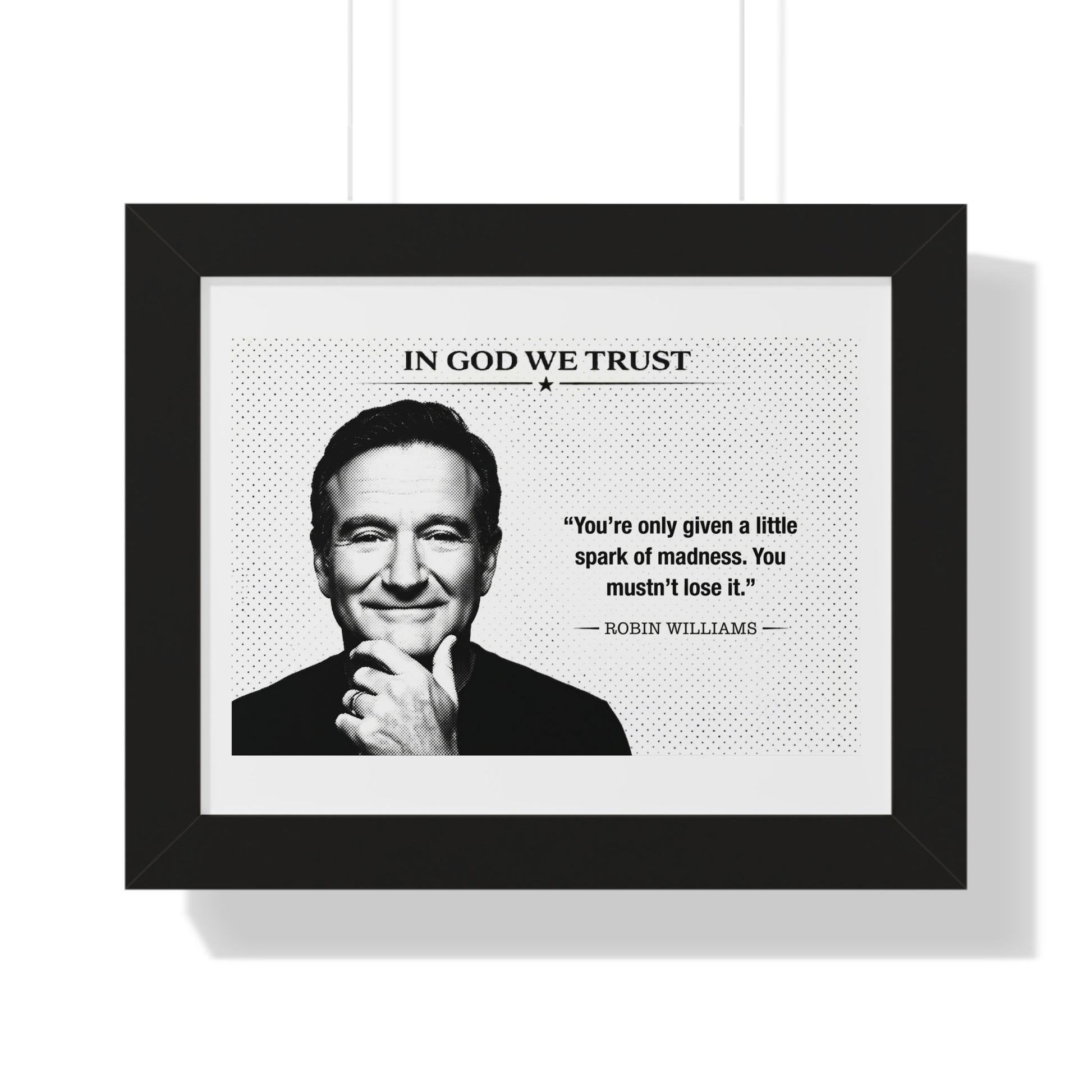 Framed print with a portrait of a person and a quote by Robin Williams, featuring the text 'In God We Trust'.