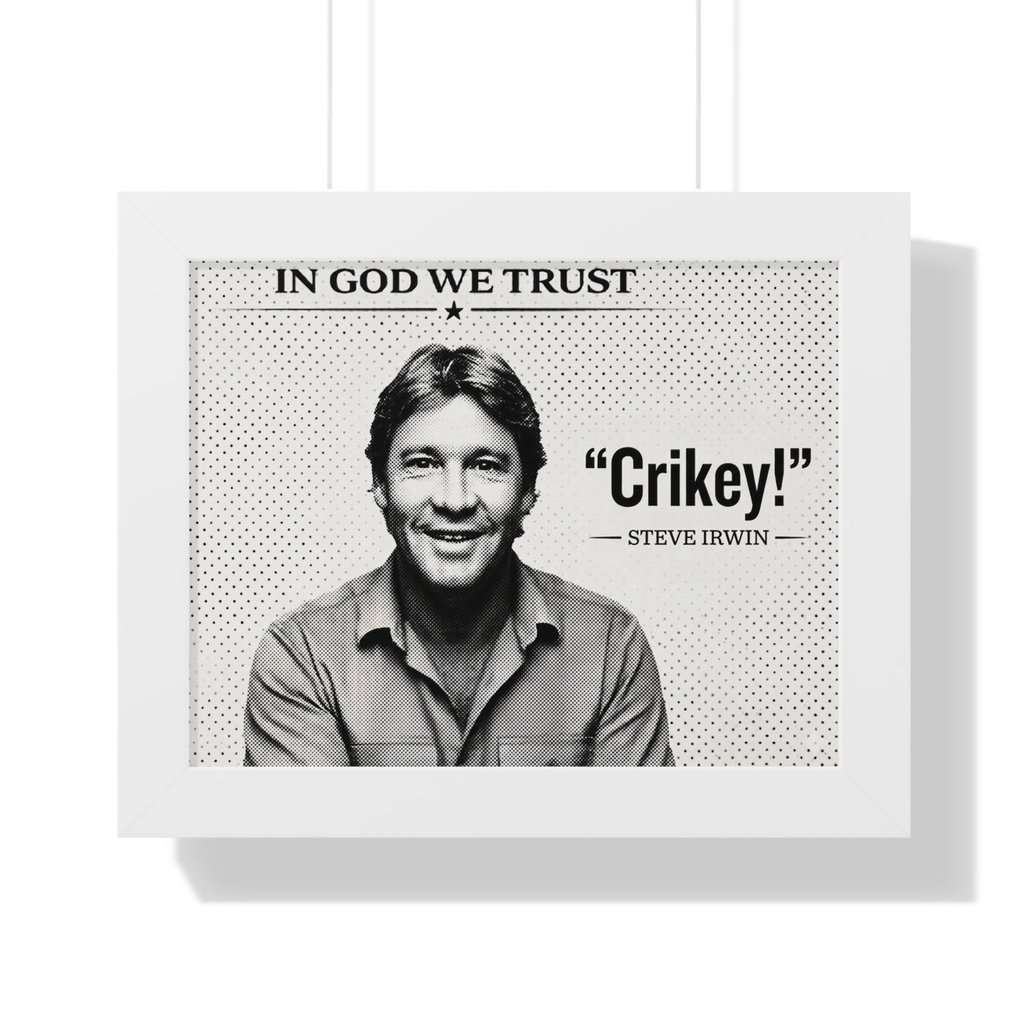 Framed poster with a black and white photo of a person, text 'In God We Trust', and 'Crikey!' quote by Steve Irwin.