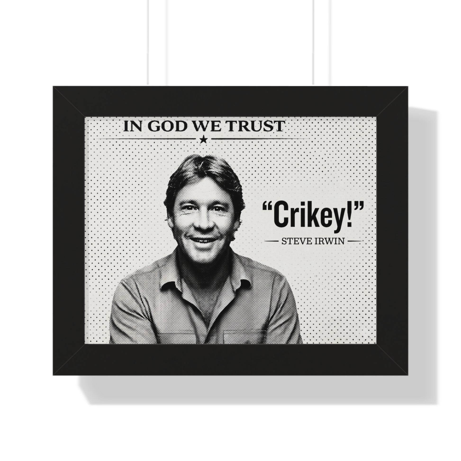 Framed poster with a black and white photo of a person and text 'In God We Trust' and 'Crikey! Steve Irwin'.