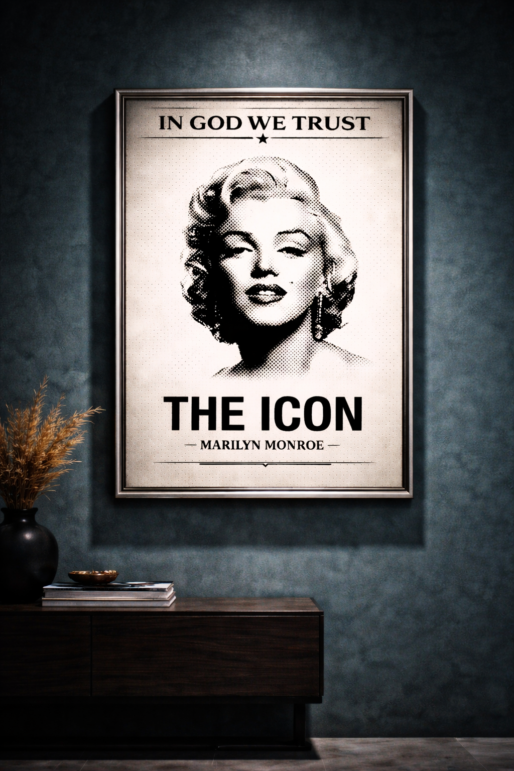 Framed poster of Marilyn Monroe with text 'In God We Trust' and 'The Icon Marilyn Monroe' on a dark wall.