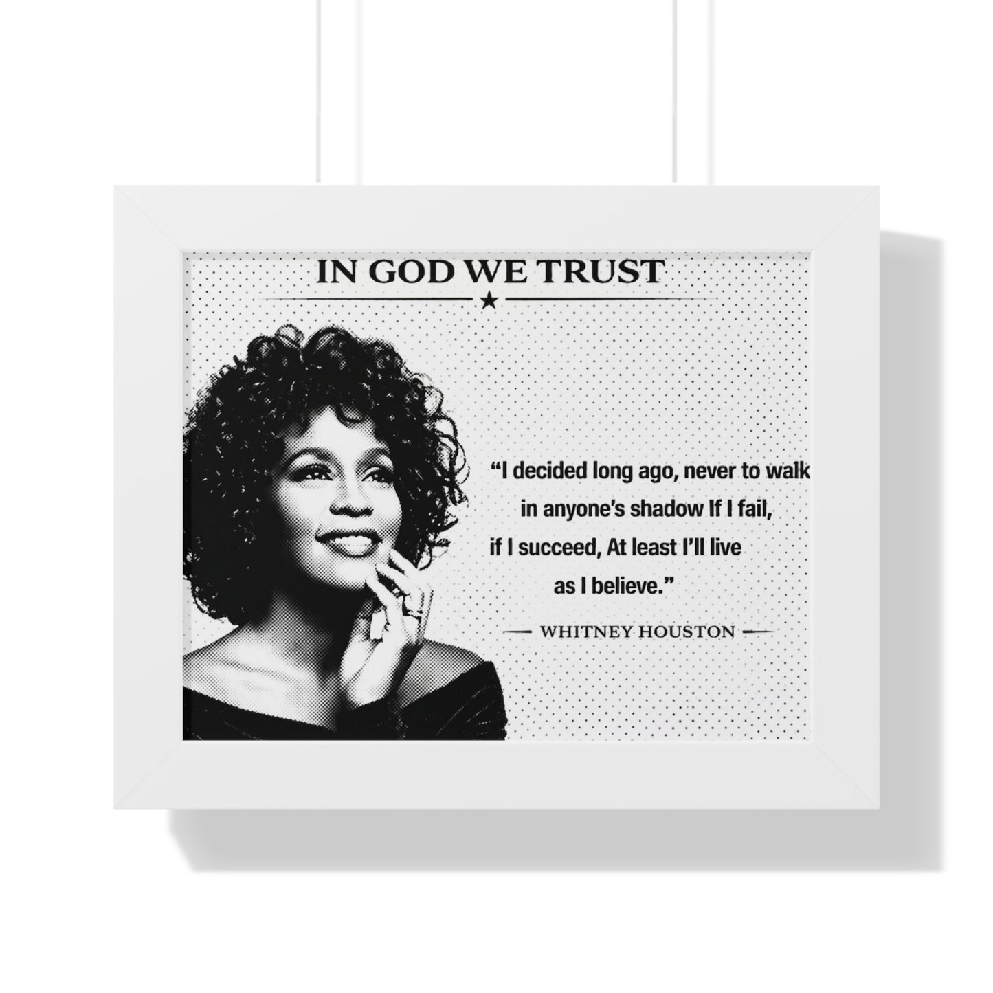 Framed poster with black and white portrait of a famous person and a quote, featuring the text 'In God We Trust'.